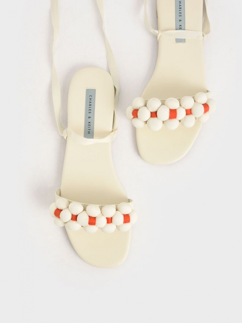 Charles & Keith Pom Pom Tie-Around Flate Sandaler Pisket Krem | KIBLT3920